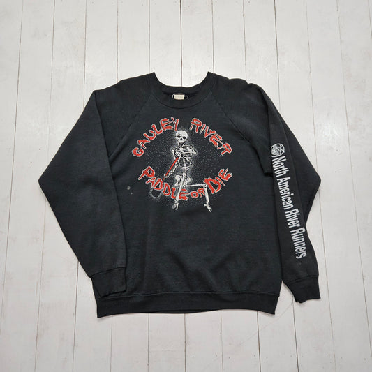 1990s Fruit of the Loom Black Cauley River Paddle or Die Skeleton RIver Runners Rafting Raglan Sweatshirt Made in USA Size L - People's Champ Vintage -Sweatshirts/Hoodies